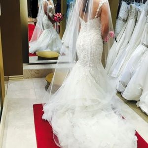 Never used or worn ivory size 12 Eve of Milady. PRICE IS NEGOTIABLE